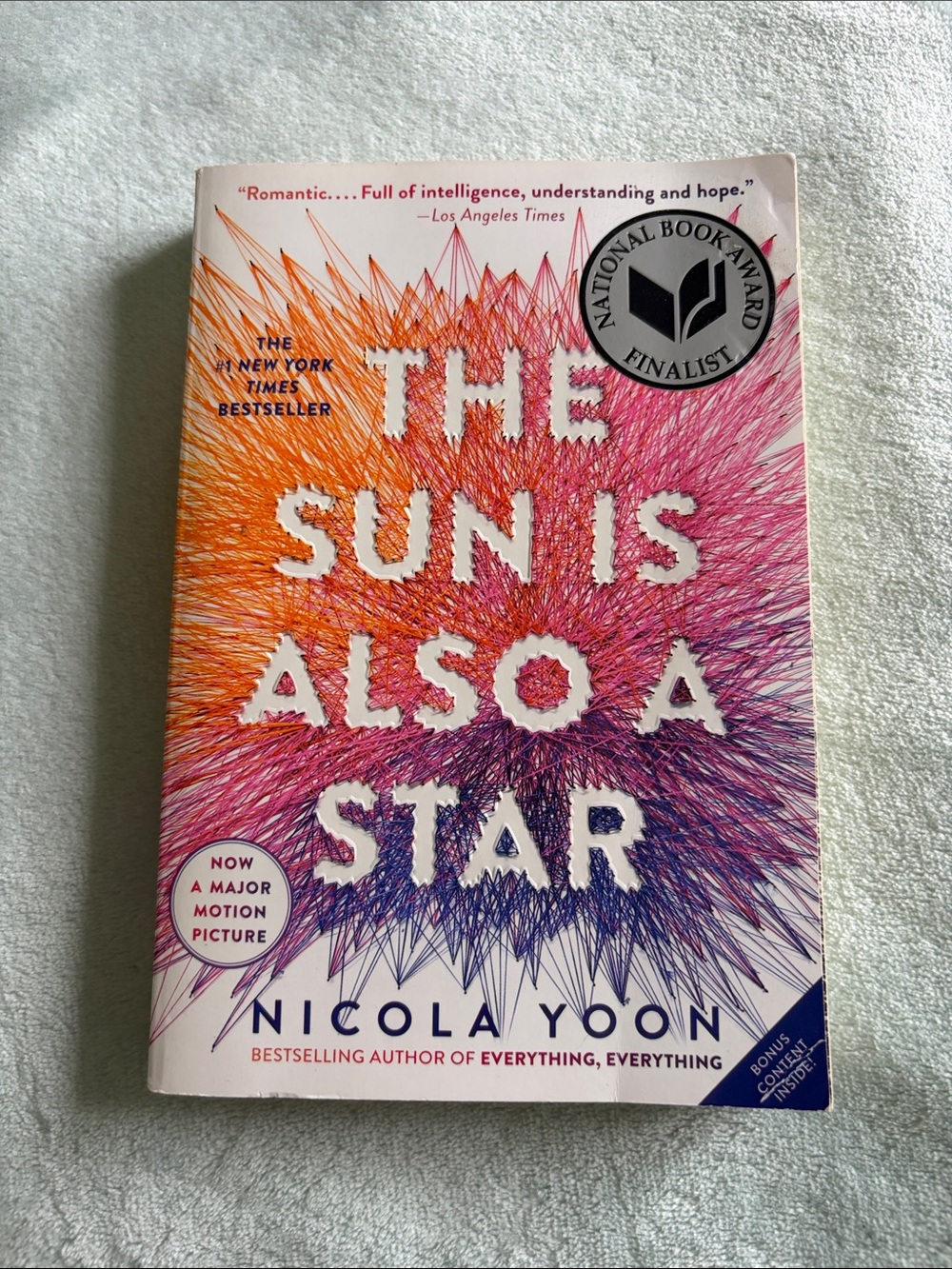 The Sun Is Also a Star by Nicola Yoon - Vibrant Orange/Pink/Purple Cover
